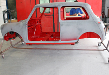 Mini body shell primed with painted red interior