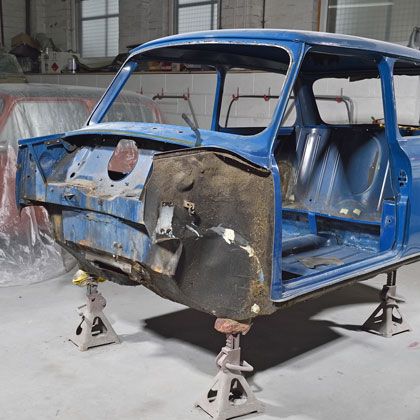 A classic Mini shell stripped due to rust.