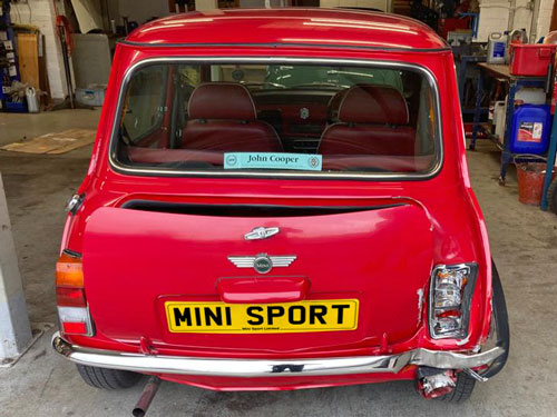 A classic Mini, damaged when in an accident