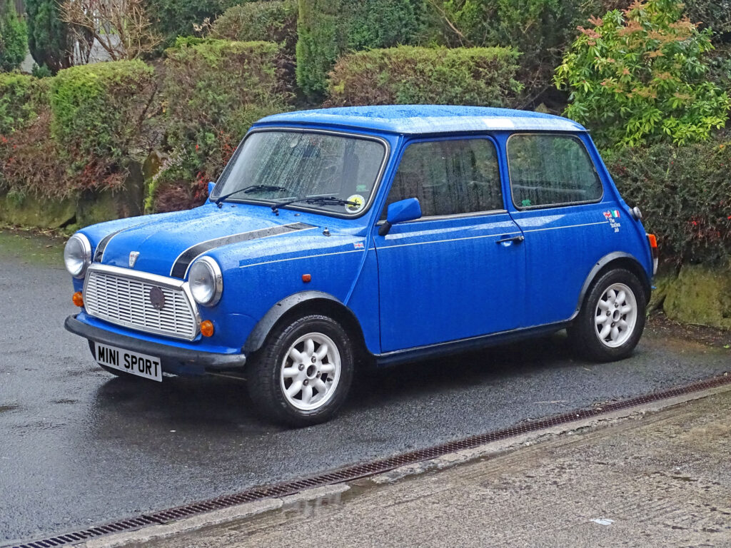 Blue classic Mini in the rain