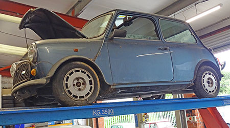 Barn find Mini on ramps in Mini Sport Garage