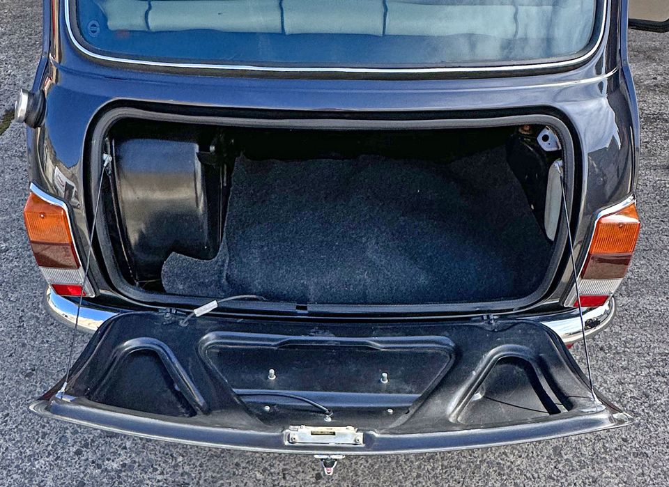 Inside boot view of 1997 Rover Mini, displaying its spacious storage area and clean condition.