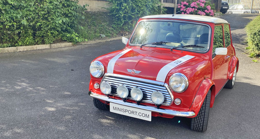 Finished restoration of a Mini Cooper Mpi, painted in Flame Red at Mini Sport.