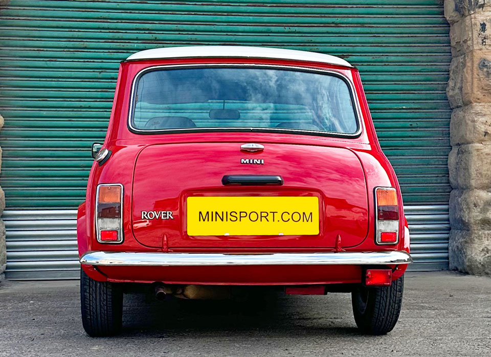 Rear of a 1996 Mini Kensington in Red with a White roof.