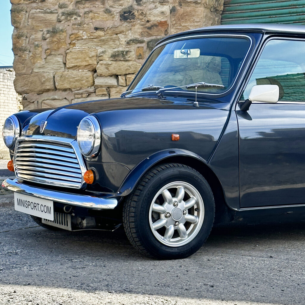 Close-up of the wing on 1997 Rover Mini, showing its sleek lines and well-maintained condition.