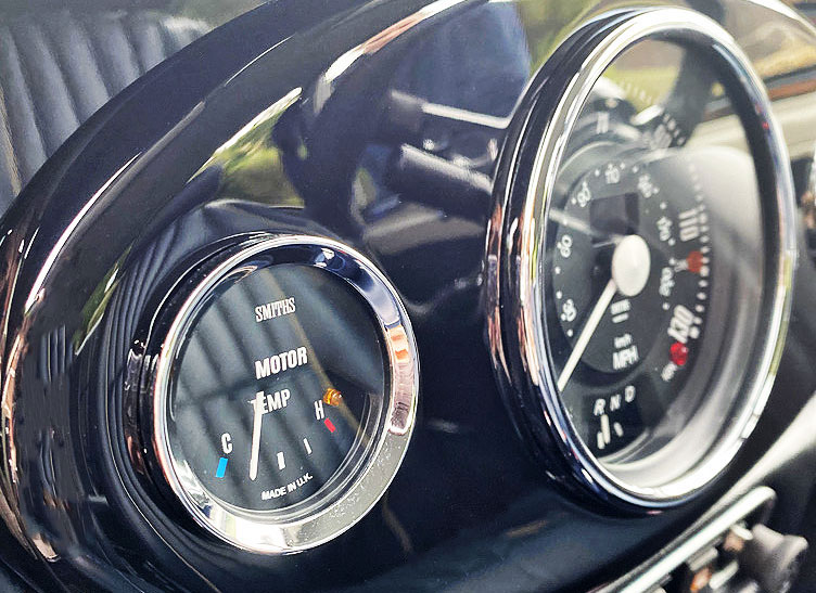 Close-up of the centre 3 clock dash in 1999 Mini Cooper 40 EV 'Merlin', showcasing its vintage-inspired interior.