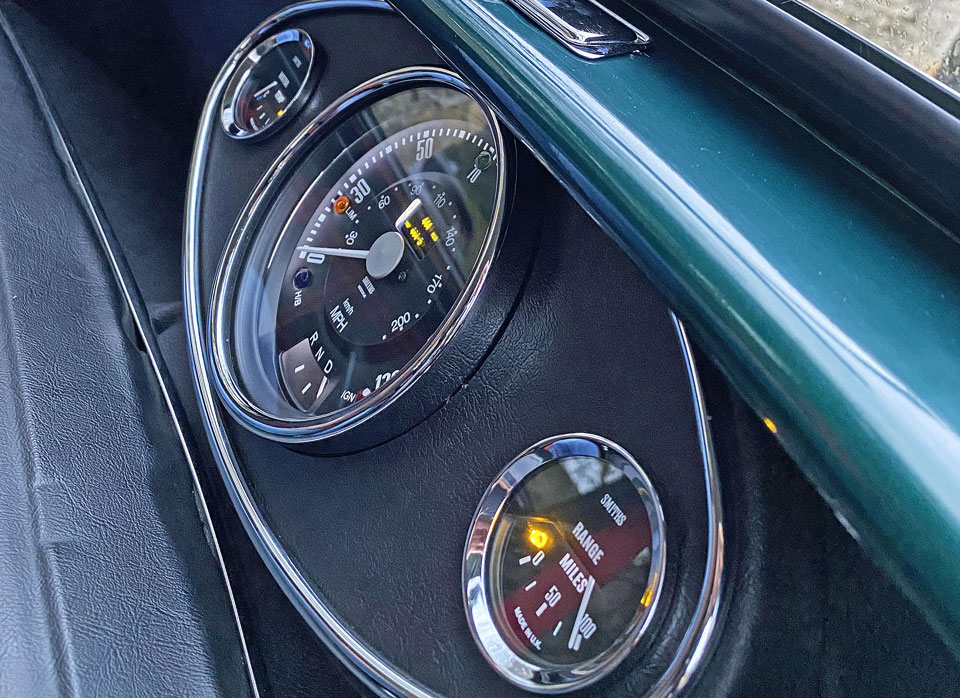 Close-up of the clocks on the dashboard of 1995 Mini Cooper EV