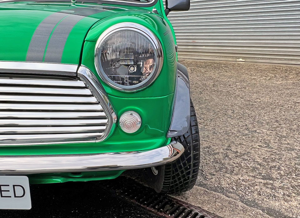 Lights on 1995 Mini Cooper EV, showcasing its classic design