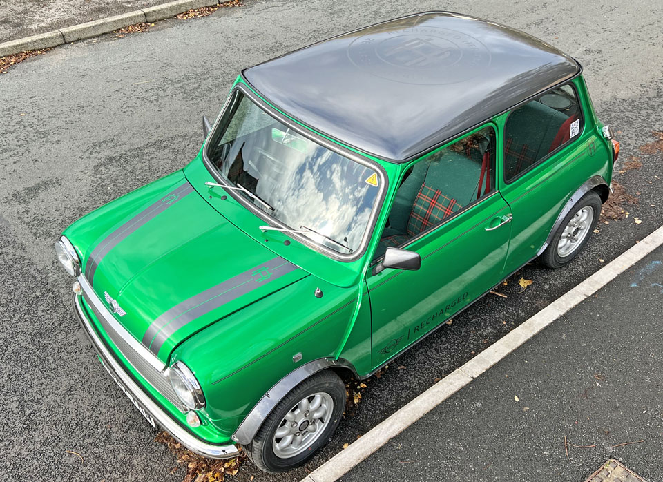 Top view of 1995 Rover Mini Cooper EV, showcasing its classic design and stunning green color.