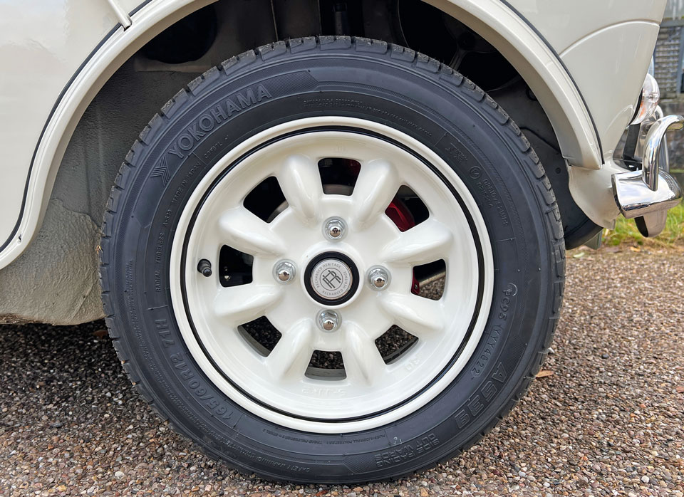 Custom wheels painted in body color on 1999 Rover Mini Cooper 40 EV 'Merlin', enhancing its unique and sporty appearance.