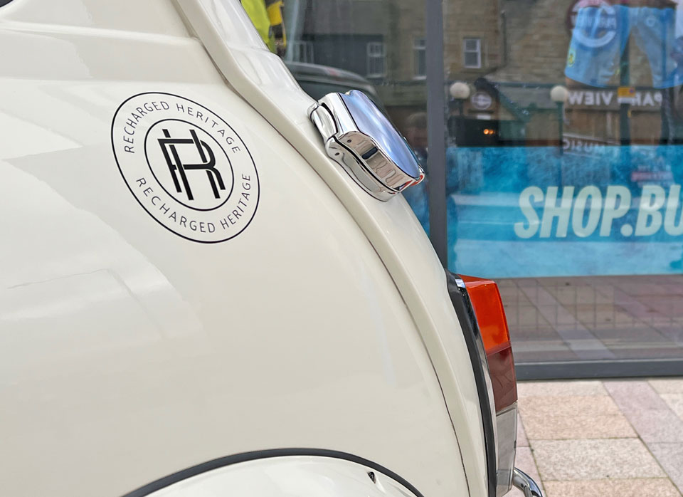 Close-up of the charge point on 1999 Mini Cooper 40 EV 'Merlin', highlighting its electric charging capability.