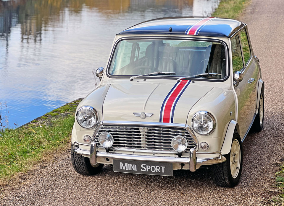 Front view of 'Merlin' Mini Sport Classic Mini EV, showcasing its timeless.