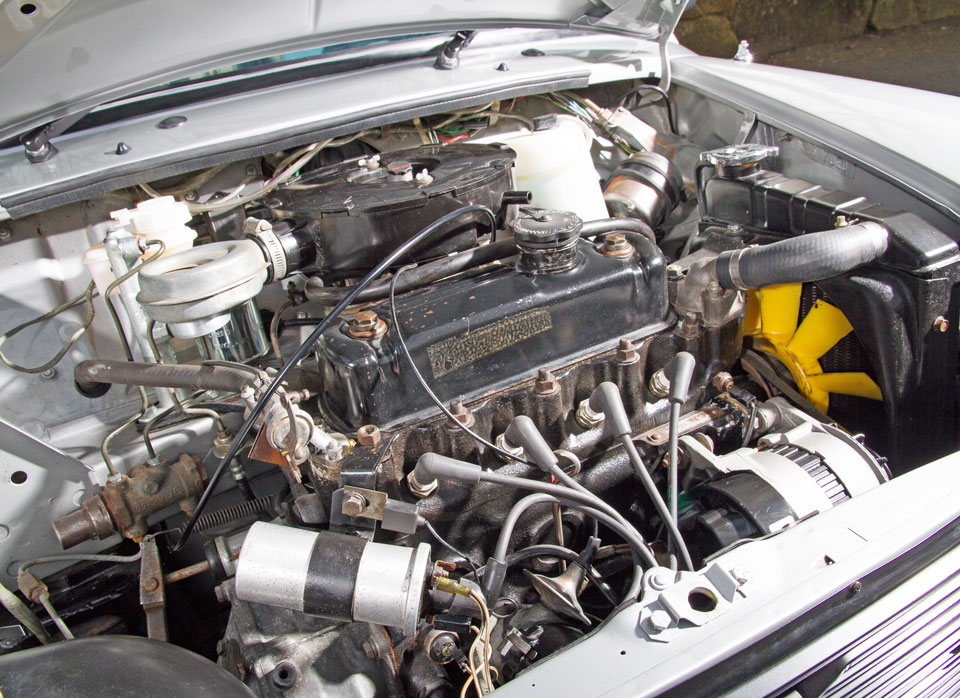 Under bonnet view of Mini Special, revealing its 1.1 engine and meticulous restoration.