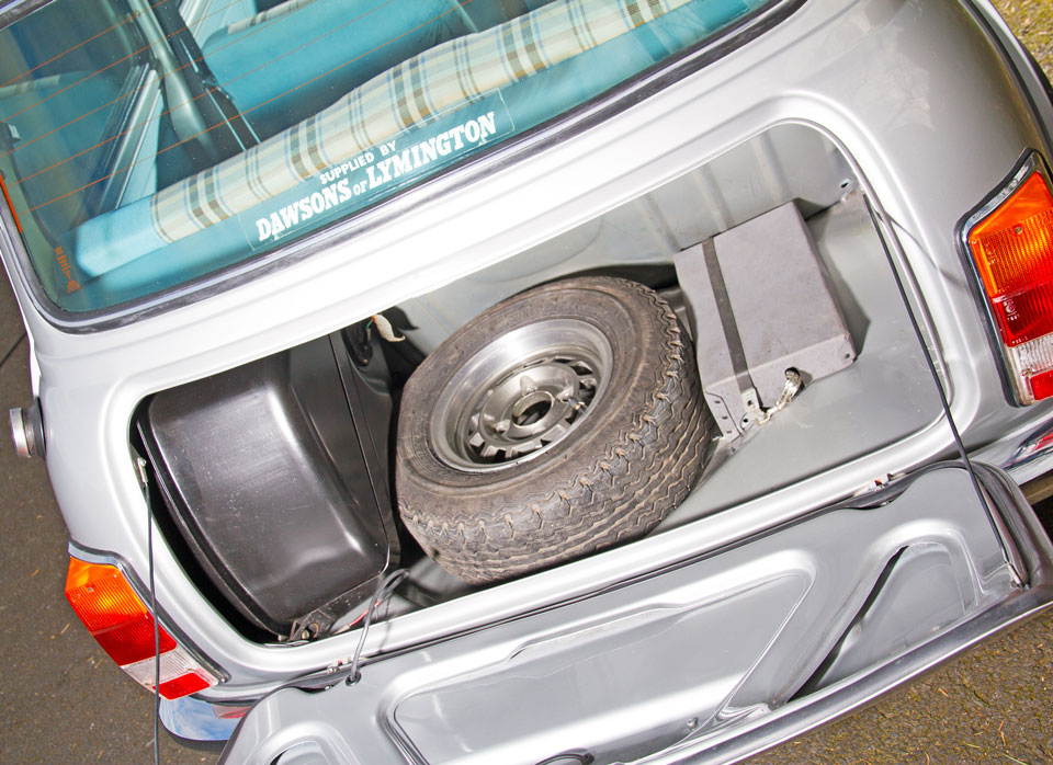 Inside boot view of Mini Special, featuring the fuel tank and spare wheel.