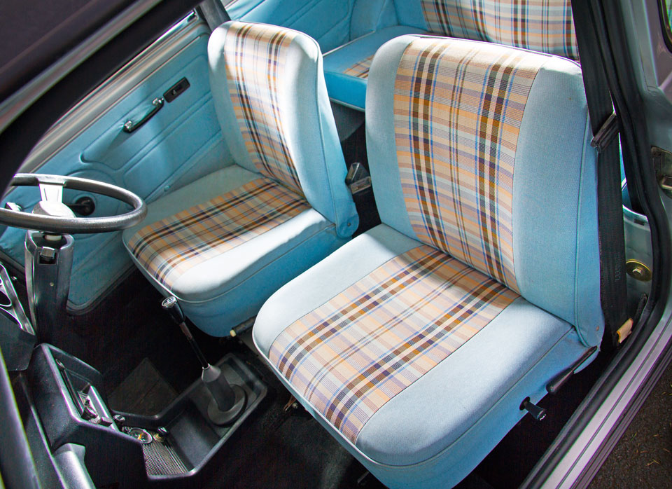Close-up of light blue and grey tartan check seats in Mini Special, offering both style and comfort