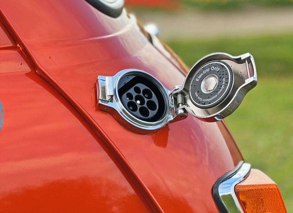 The fuel cap on the Mini Cooper EV, showcasing its modern design and functionality.