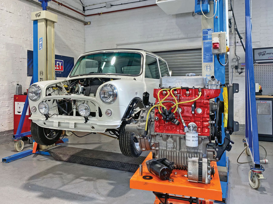 Image showcasing a fully reconditioned 1275cc SPi engine and a new British Motor Heritage body shell installed in a classic Mini Cooper, meticulously restored by Mini Sport.