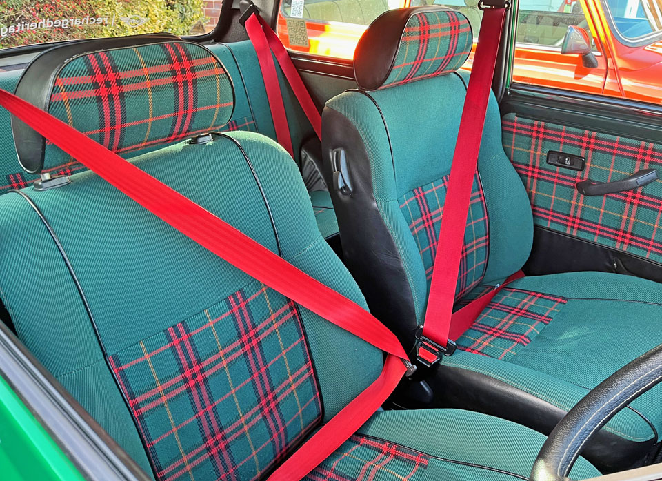 Original Classic Mini Seats, finished in a green and red Tartan pattern.