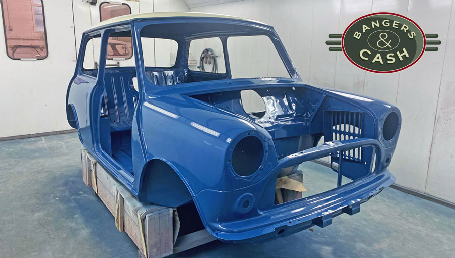 Painted Shell of a Mini Cooper Restoration, painted in Island Blue and Snowberry White Roof.