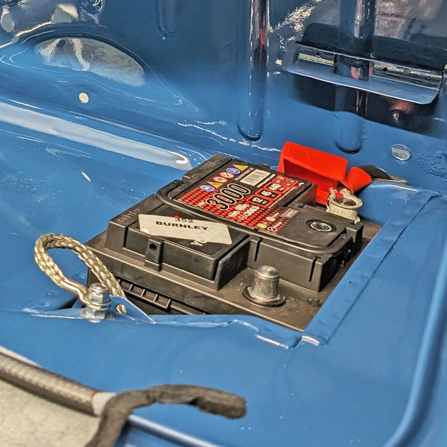 Battery fitted to the boot of a Mini Cooper.