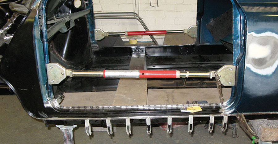 Door braces used to maintain the shape of a Mini shell during repairs.