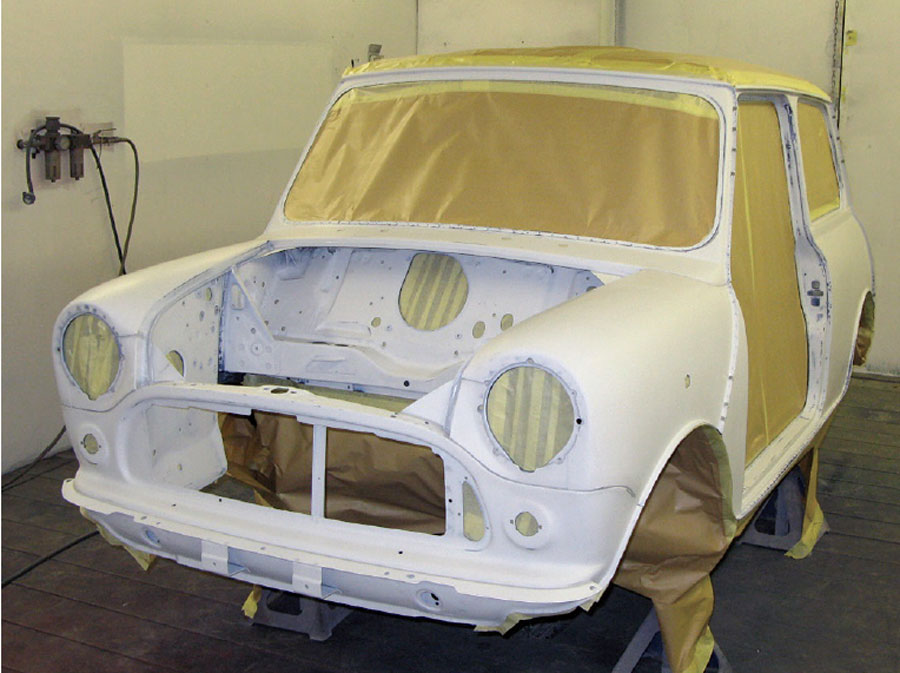 Masked Mini shell sections prepared for applying different paint colors.