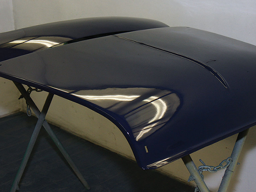 A freshly painted Mini bonnet with a high-quality finish, ready for installation.