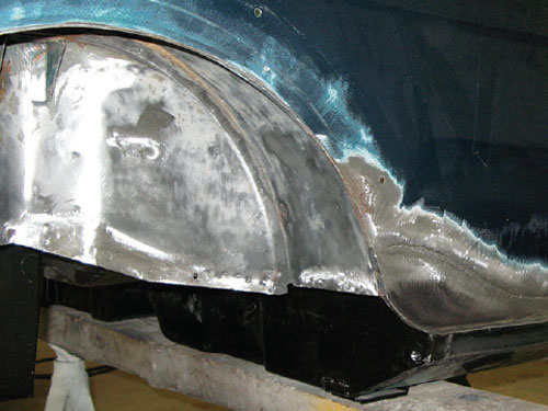 Repaired Mini rear panel ground flat to create a smooth surface.