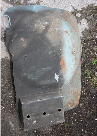 Rusted boot floor of a classic Mini, exposed during strip down of the restoration.