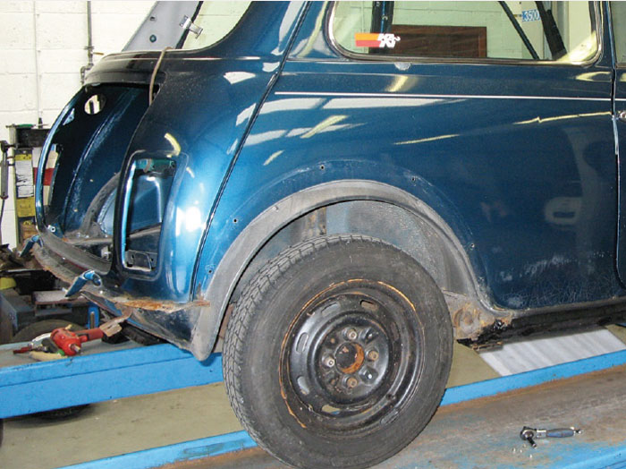 Mini with original wheel arches discovered in the strip down beneath later-model Sport Pack arches.