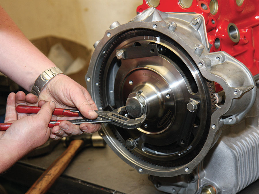 crank-bolt Crank bolt being secured to the flywheel with Loctite and lock-tab washer.