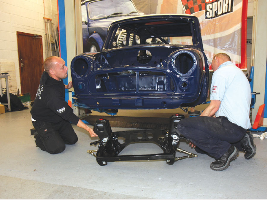 Subframe being lifted into the shell, ready for the suspension.