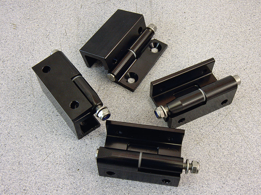 Prototype aluminium door hinges for the Bogus 2 Mini, showcasing their lightweight design and easy removal feature.