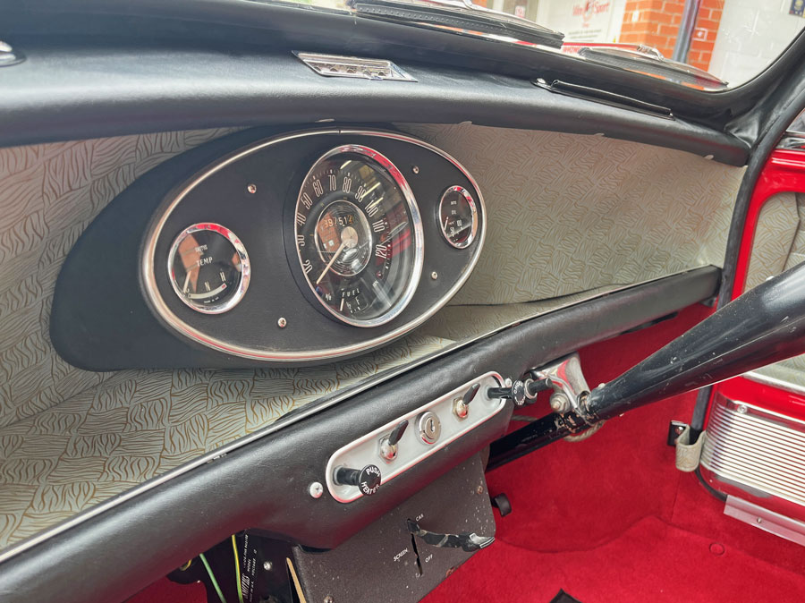 Close-up of the centre clock in a 1965 Austin Mini Cooper S dashboard
