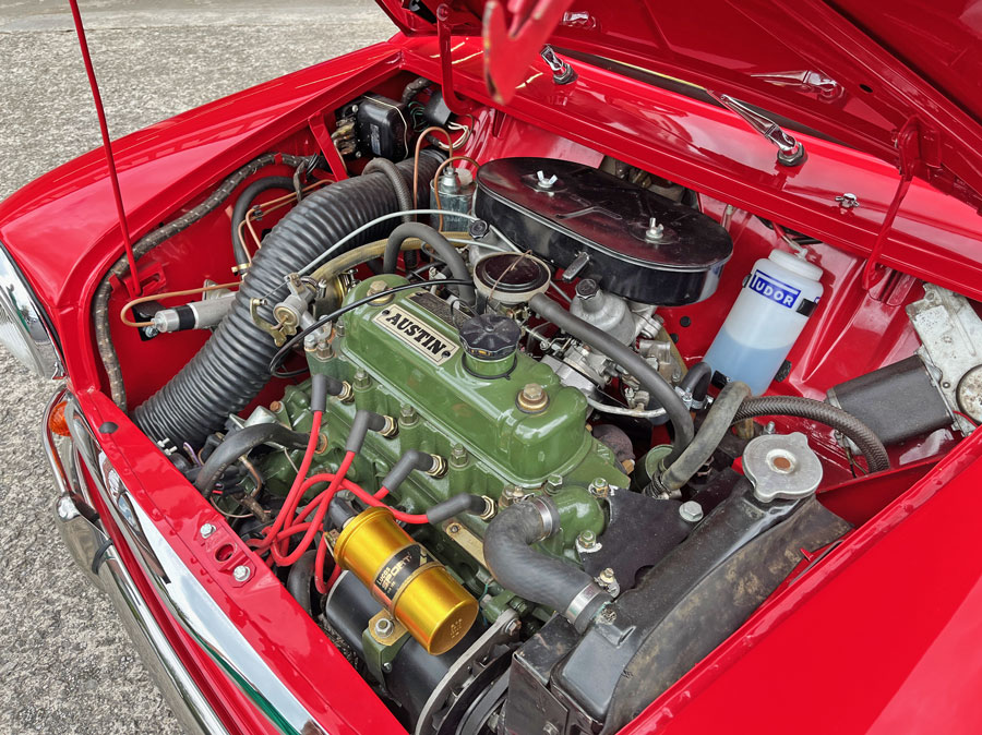 Engine bay of a mk1 Mini featuring a 1275cc engine.