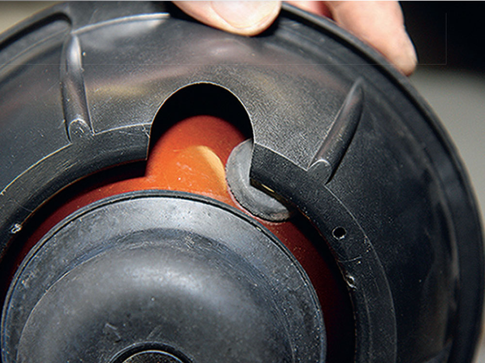 Newly replaced headlight bowl on a classic Mini, showcasing the adjusted sidelight socket.