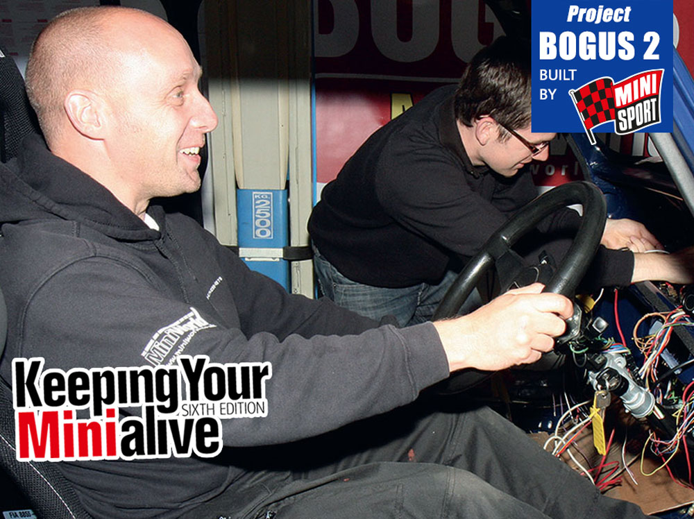 Mechanic checking the seat position in a Mini for alignment with the steering column and pedals.