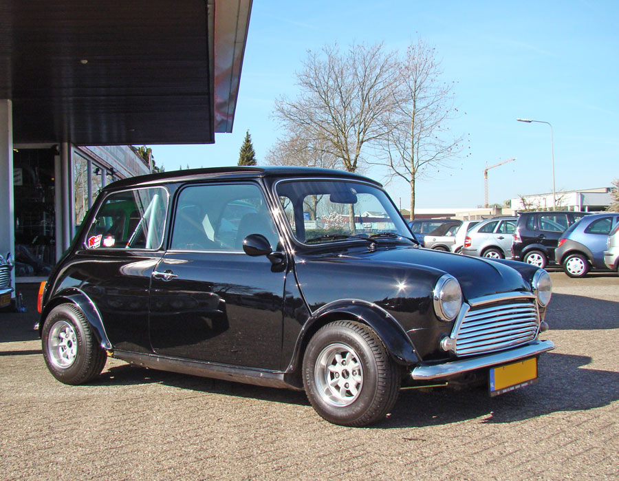 Black classic Mini parked outside the classic mini center