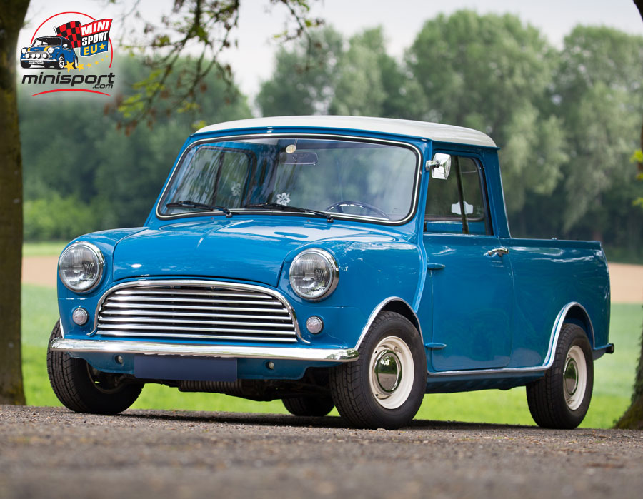 Blue Mini truck parked outdoors, showcasing its classic design.