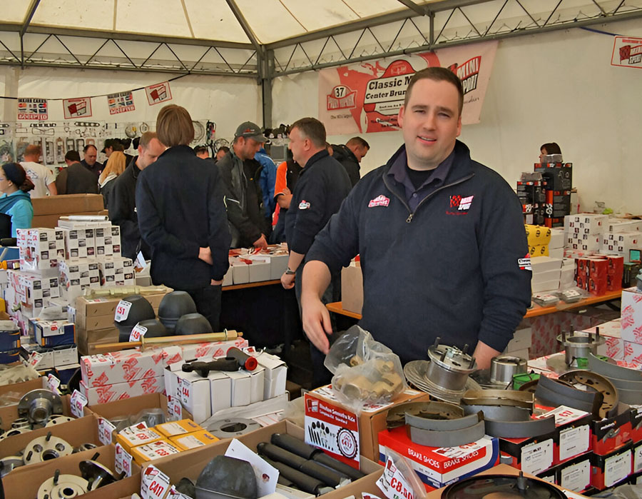 Ronald assisting customers with classic Mini parts at IMM