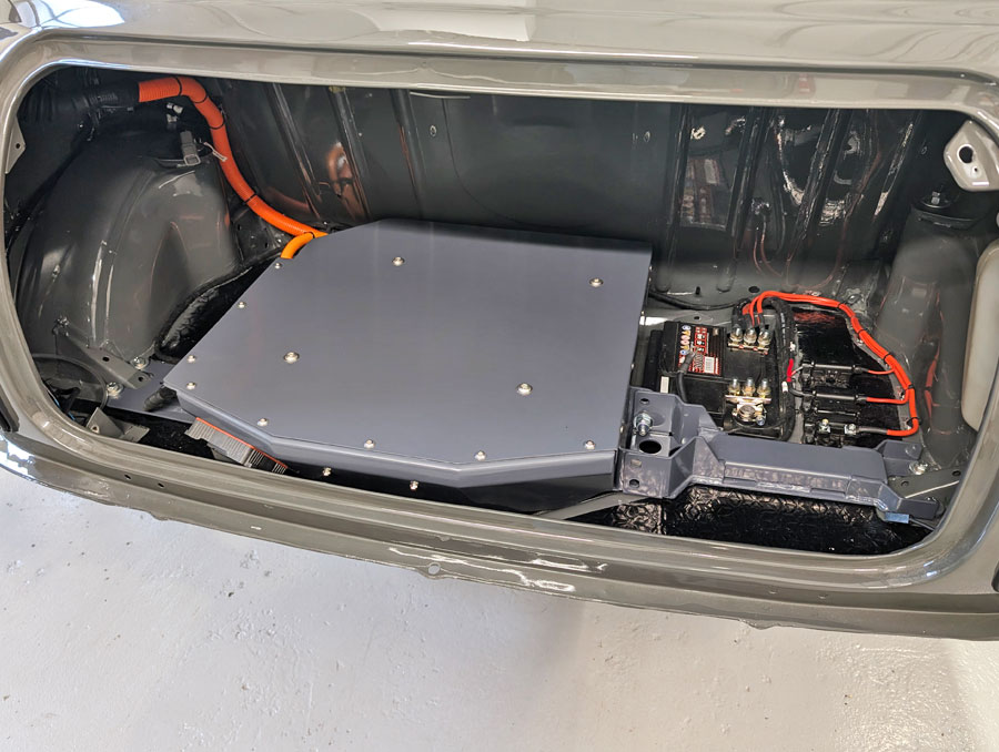Showing the 'Spectre' Mini EV rear battery pack and electronics fitted in the boot area by Mini Sport