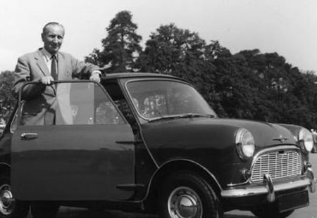 Alec Issigonis with his classic Mini